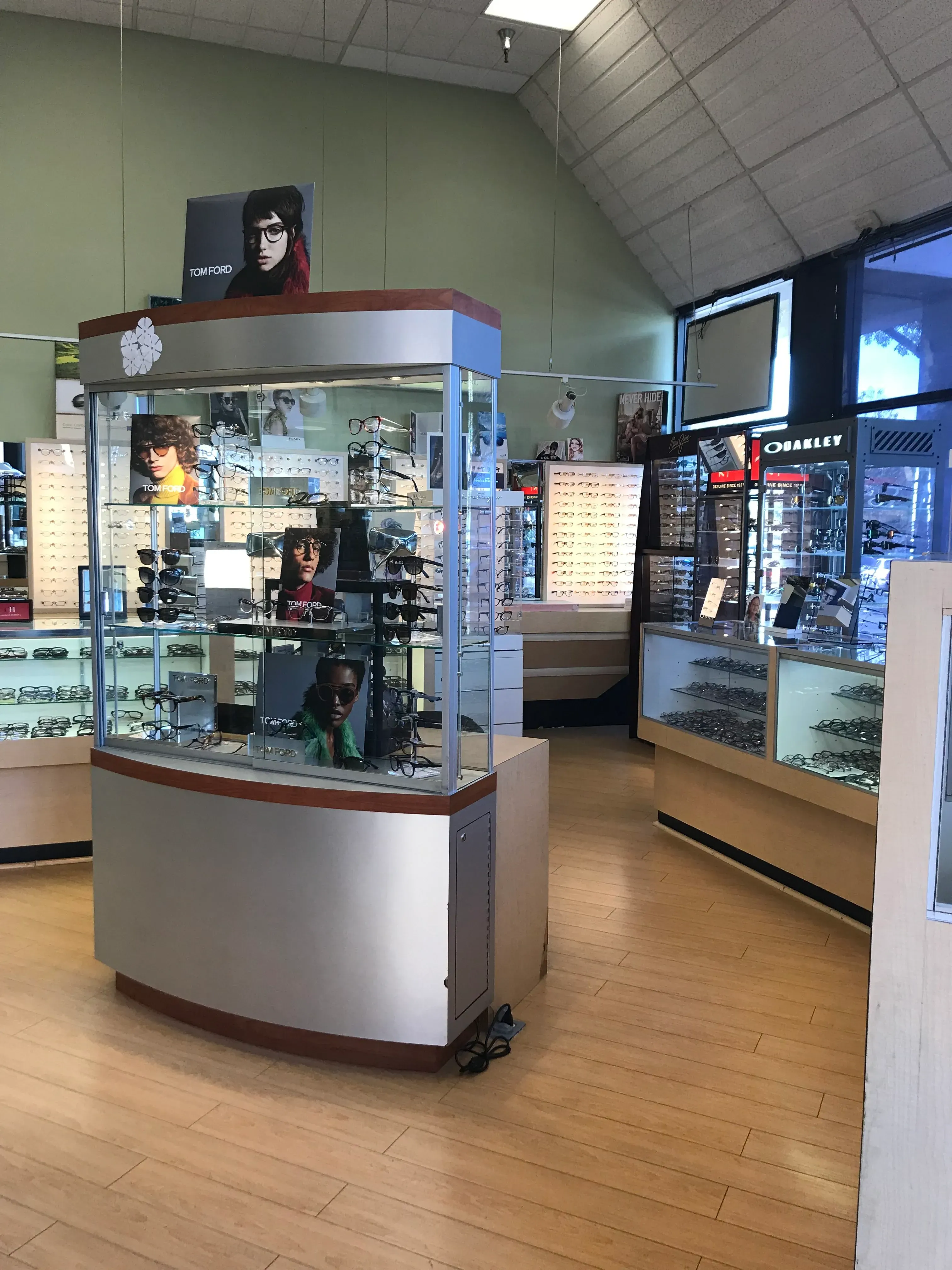 Interior of an eyewear store in Fremont, featuring display cases filled with various designer glasses and sunglasses at Site for Sore Eyes - Fremont.